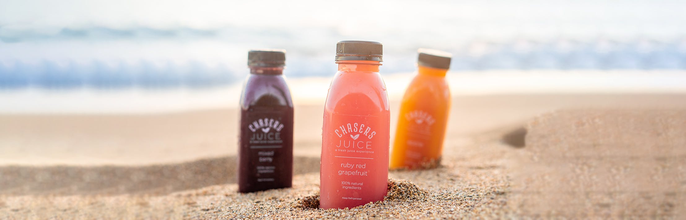 juices lined up on the beach